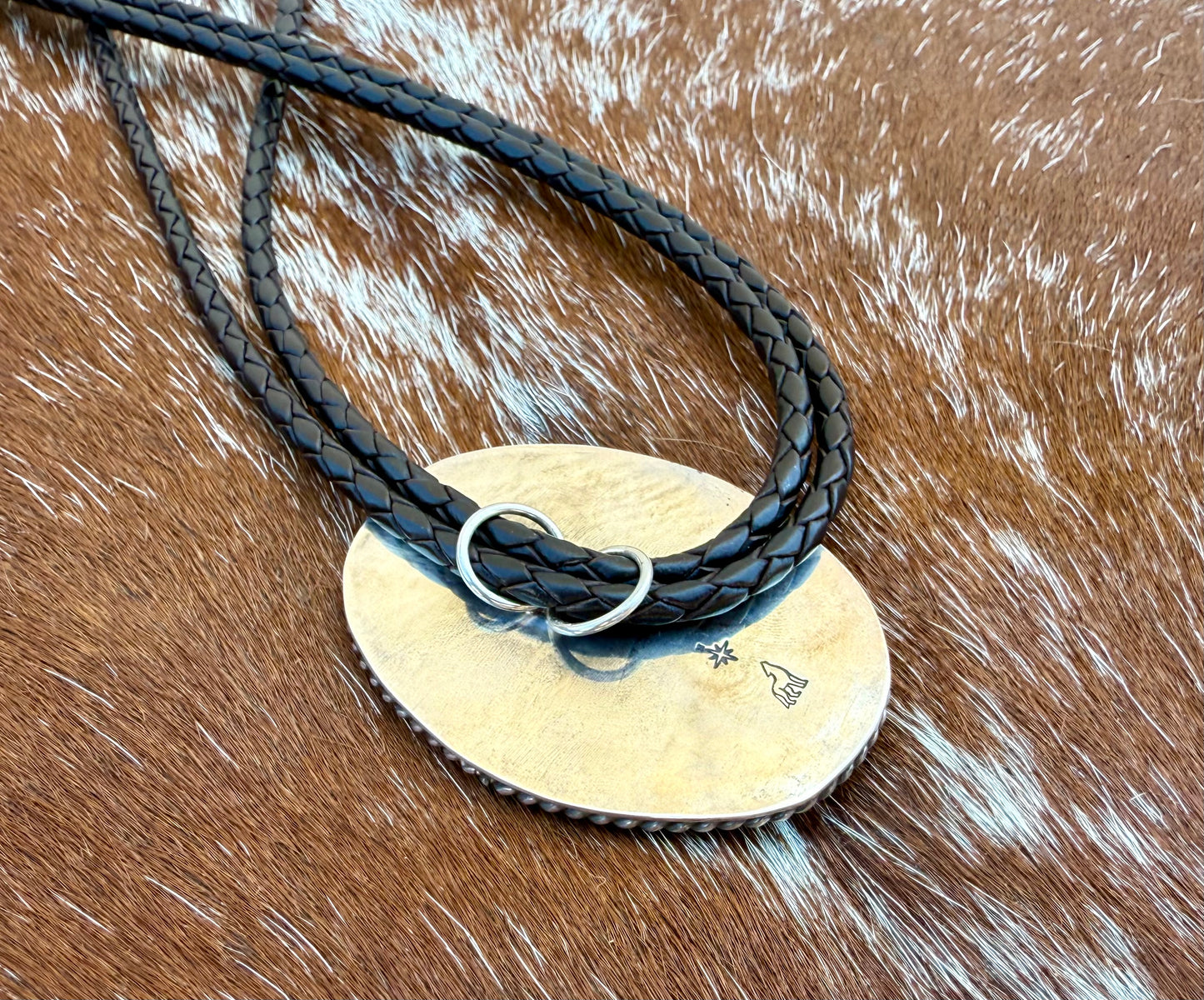 Bright Blue Kingman Turquoise Bolo Tie with dark brown leather cord and sterling silver tips
