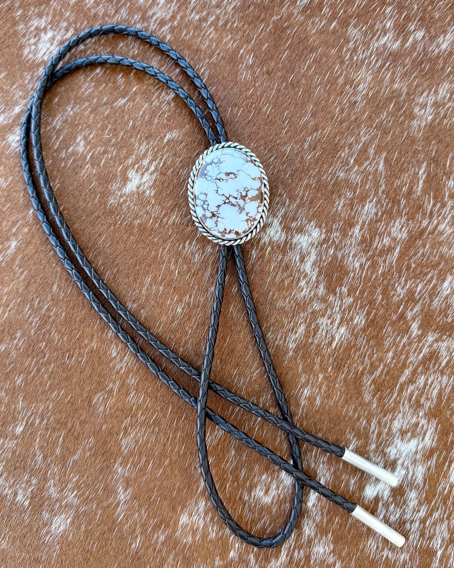 Wild Horse Magnesite Bolo Tie with dark brown leather cord and sterling silver tips