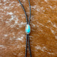 Royal Blue Royston Turquoise bolo tie with dark brown leather cord and sterling silver tips