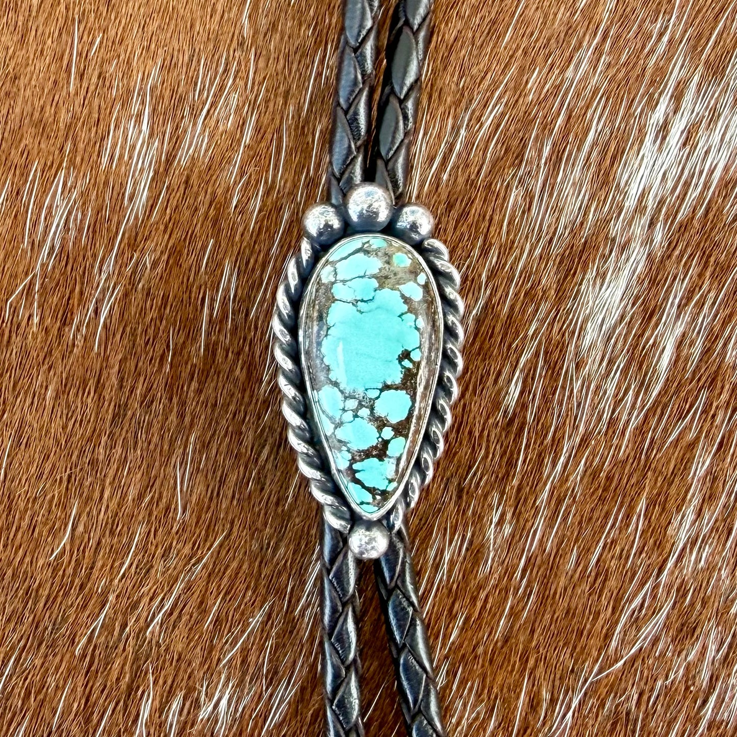 Blue Moon Turquoise bolo tie with dark brown leather cord and sterling silver tips