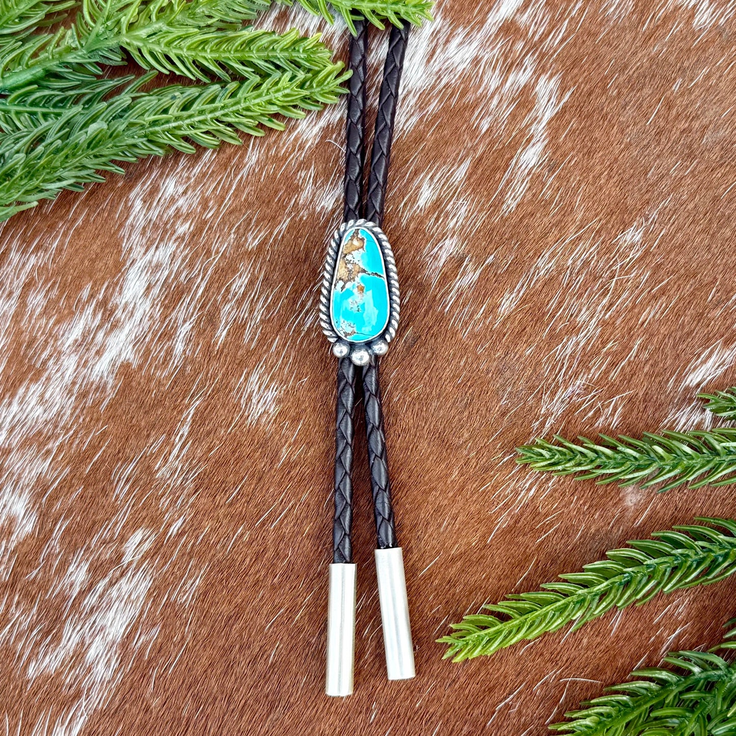Royal Blue Royston Turquoise bolo tie with dark brown leather cord and sterling silver tips
