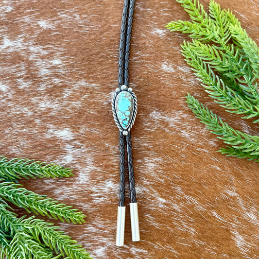 Blue Moon Turquoise bolo tie with dark brown leather cord and sterling silver tips