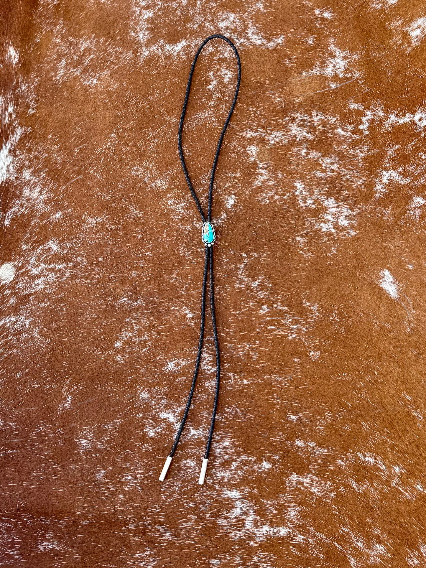 Royal Blue Royston Turquoise bolo tie with dark brown leather cord and sterling silver tips
