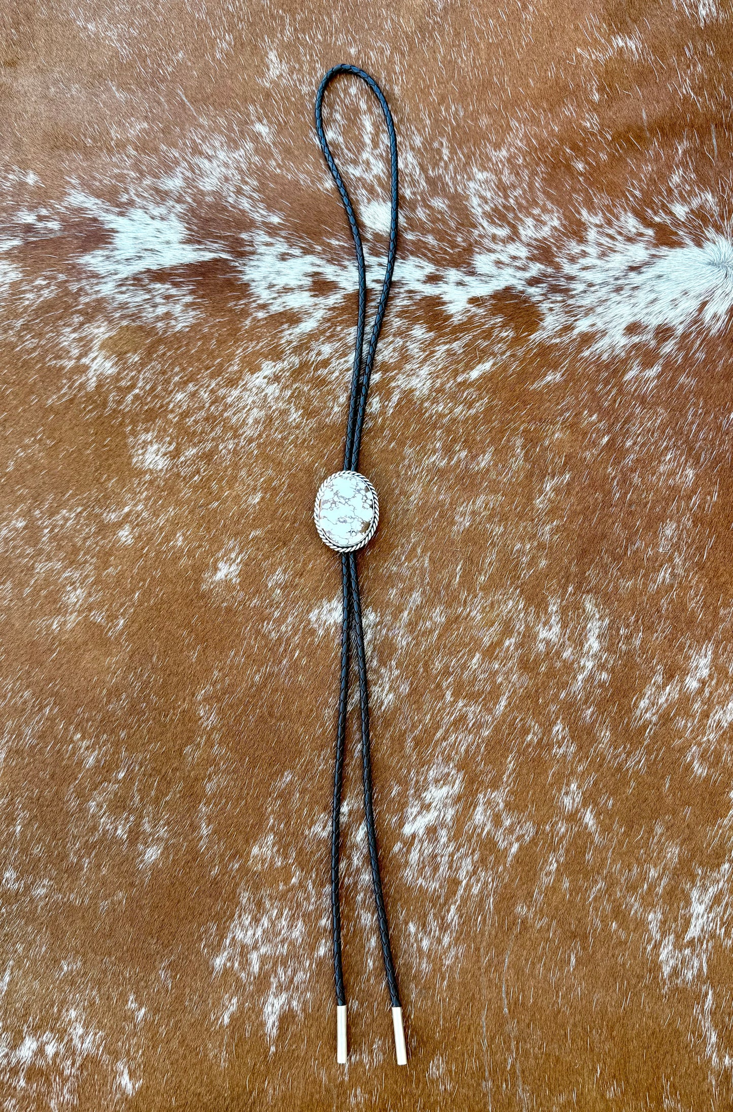 Wild Horse Magnesite Bolo Tie with dark brown leather cord and sterling silver tips