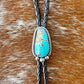 Royal Blue Royston Turquoise bolo tie with dark brown leather cord and sterling silver tips