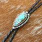 Blue Moon Turquoise bolo tie with dark brown leather cord and sterling silver tips