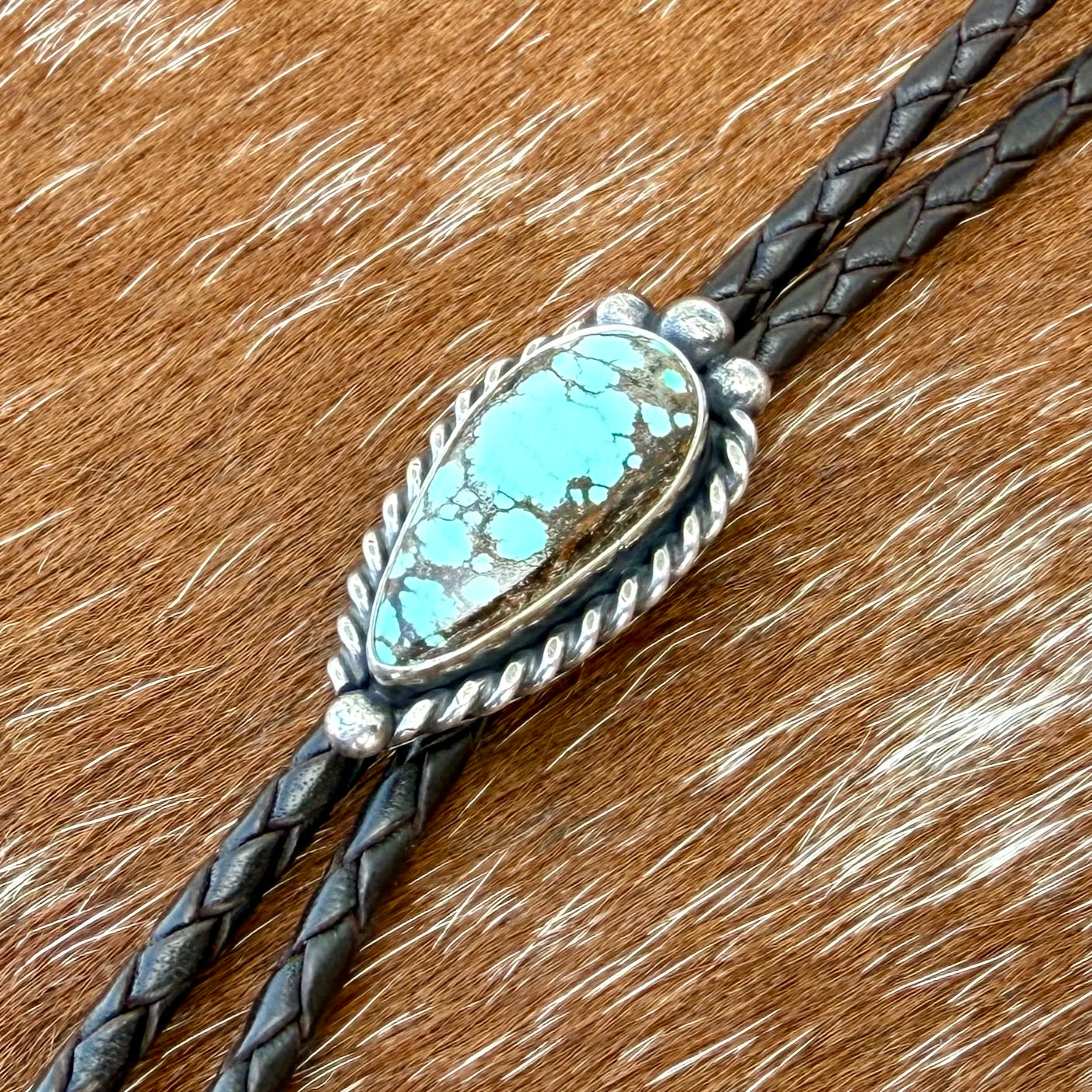 Blue Moon Turquoise bolo tie with dark brown leather cord and sterling silver tips