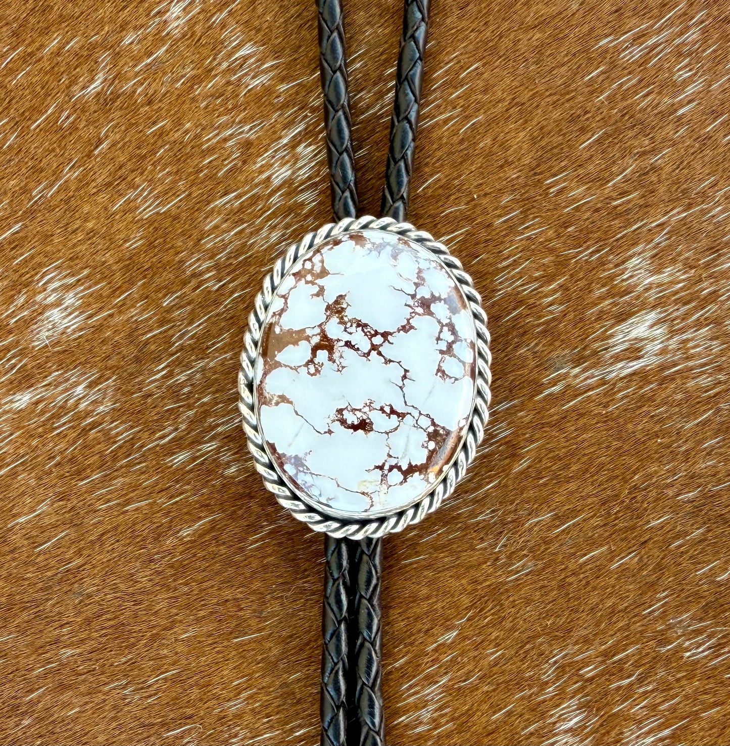 Wild Horse Magnesite Bolo Tie with dark brown leather cord and sterling silver tips