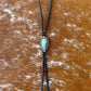 Blue Moon Turquoise bolo tie with dark brown leather cord and sterling silver tips