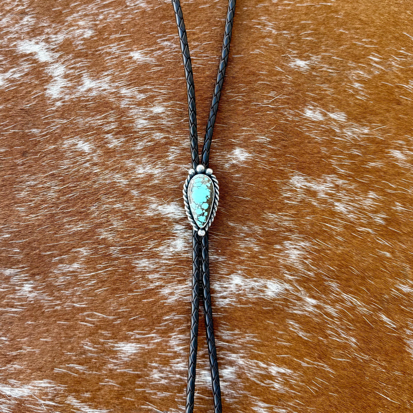 Blue Moon Turquoise bolo tie with dark brown leather cord and sterling silver tips