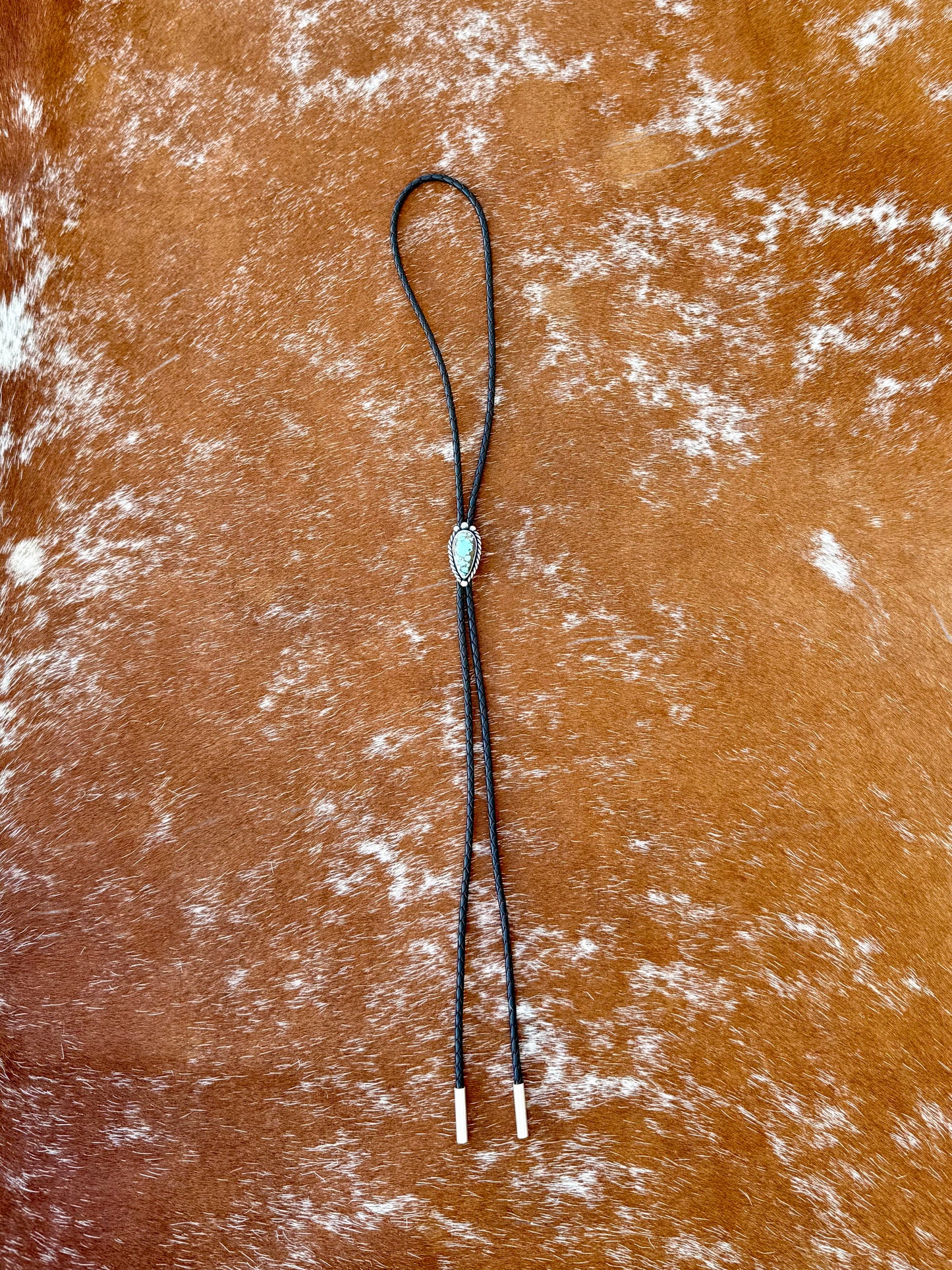 Blue Moon Turquoise bolo tie with dark brown leather cord and sterling silver tips