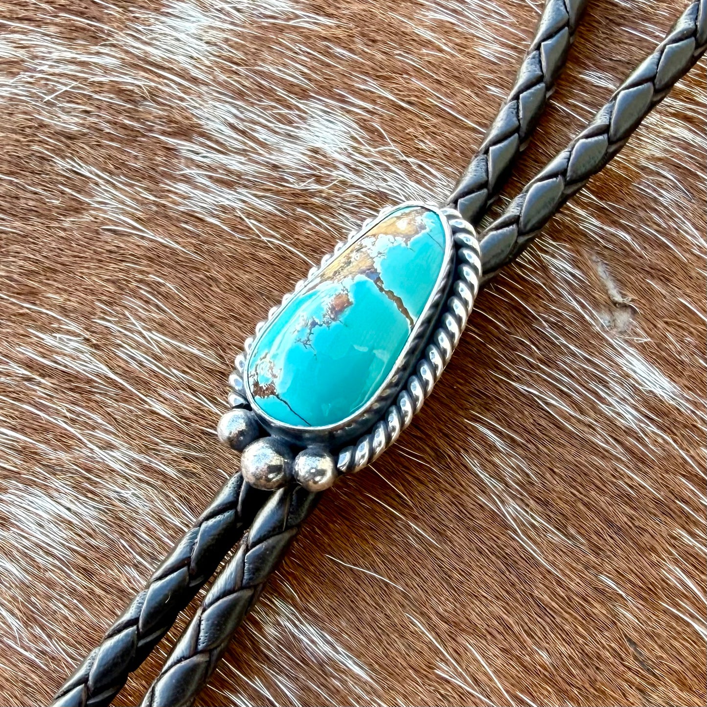 Royal Blue Royston Turquoise bolo tie with dark brown leather cord and sterling silver tips
