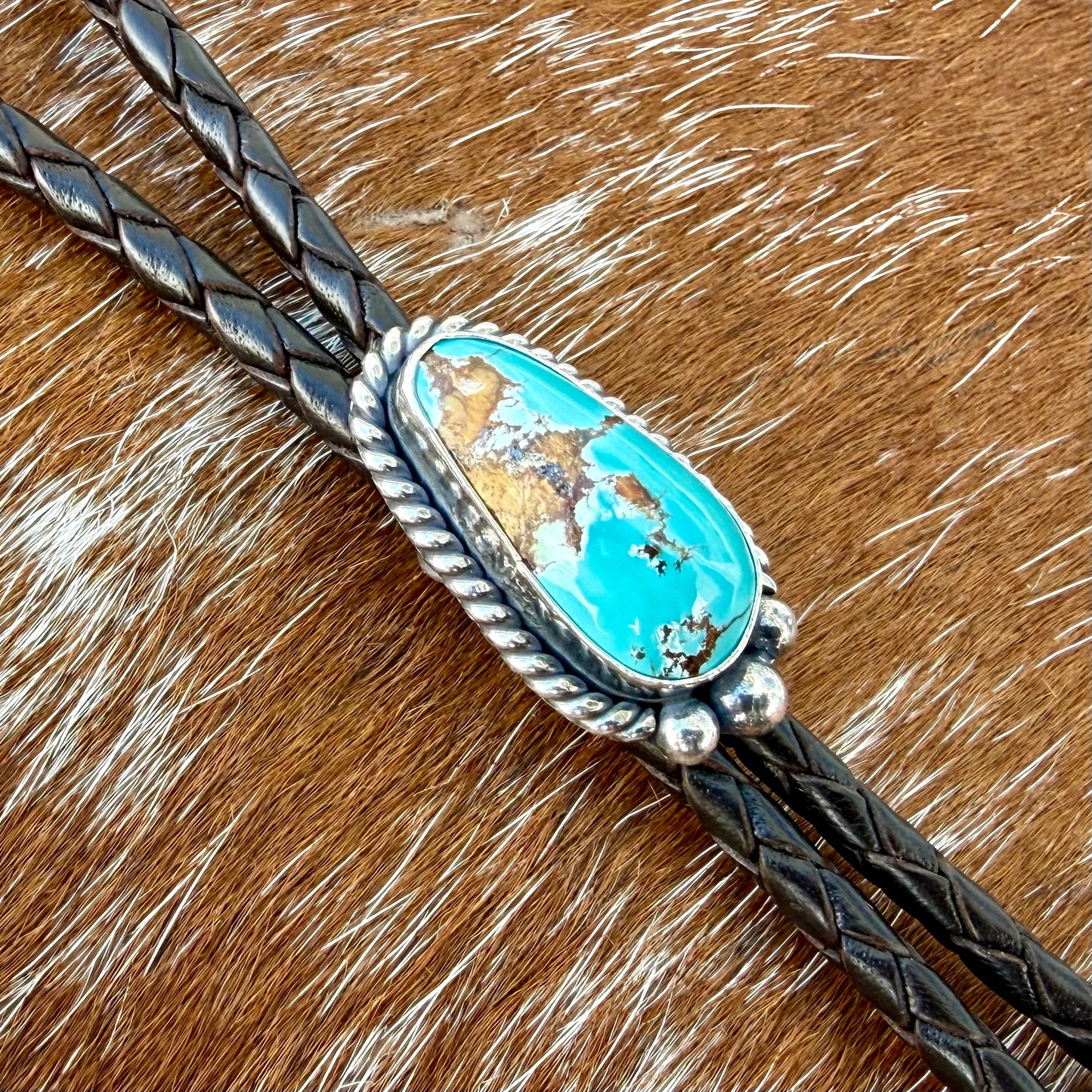 Royal Blue Royston Turquoise bolo tie with dark brown leather cord and sterling silver tips