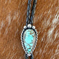 Blue Moon Turquoise bolo tie with dark brown leather cord and sterling silver tips
