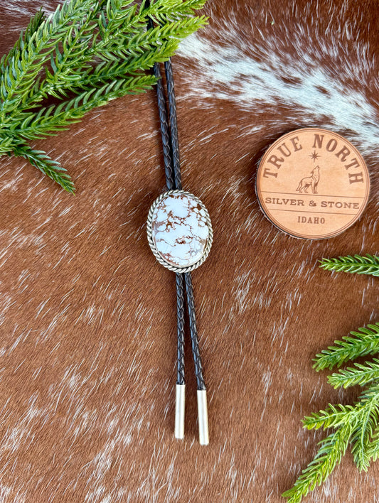 Wild Horse Magnesite Bolo Tie with dark brown leather cord and sterling silver tips