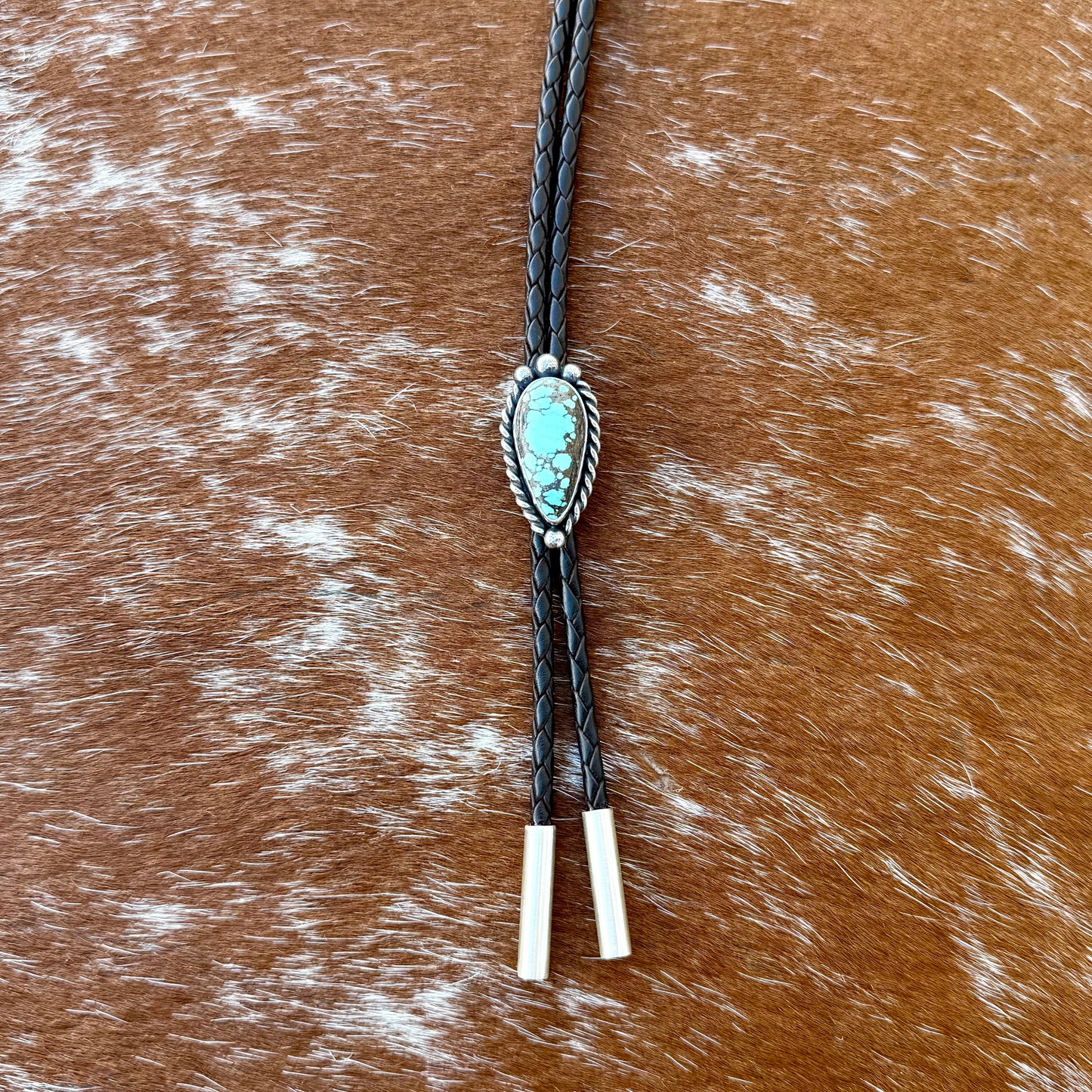 Blue Moon Turquoise bolo tie with dark brown leather cord and sterling silver tips