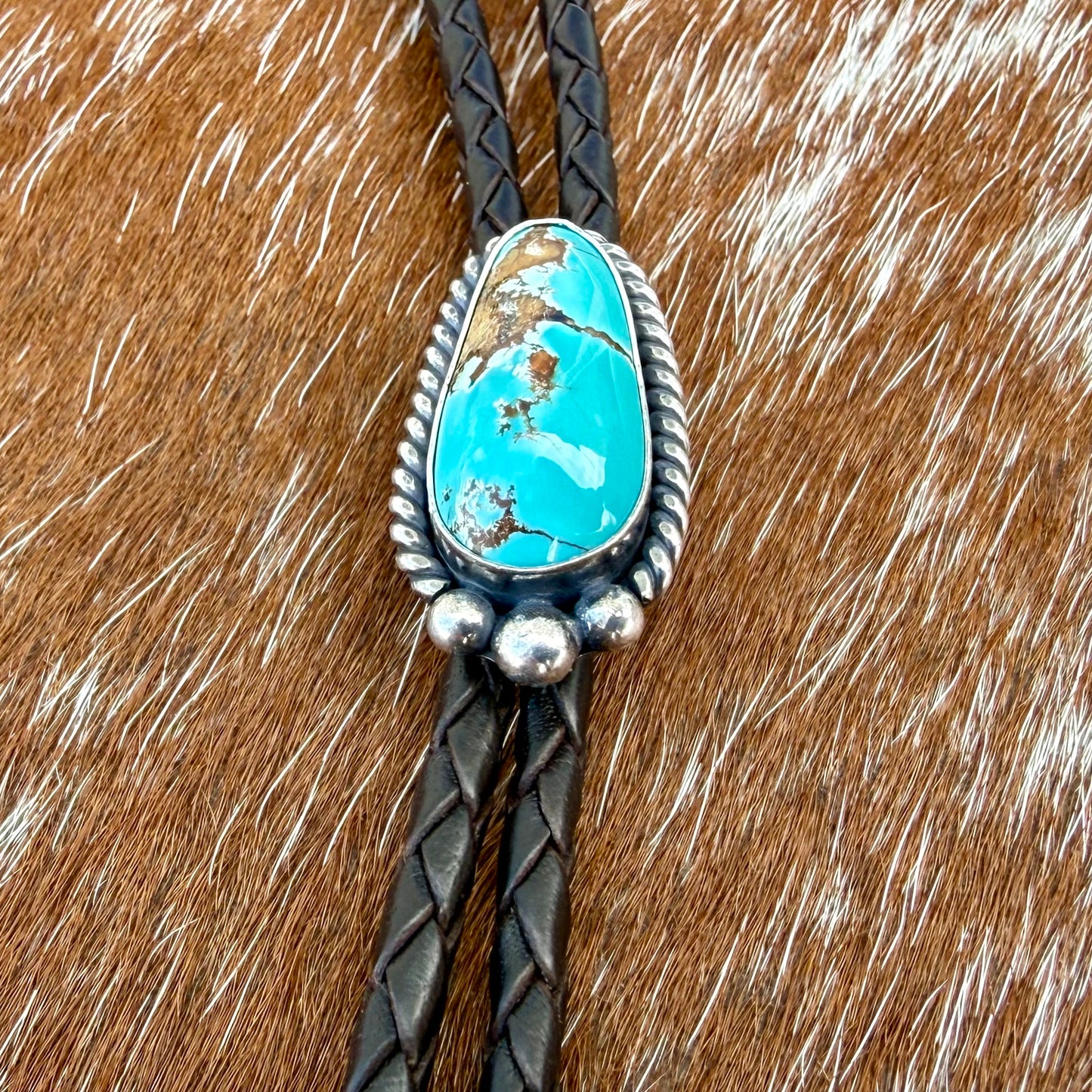 Royal Blue Royston Turquoise bolo tie with dark brown leather cord and sterling silver tips
